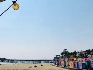 Brightly colored beach cottages near an ocean inlet